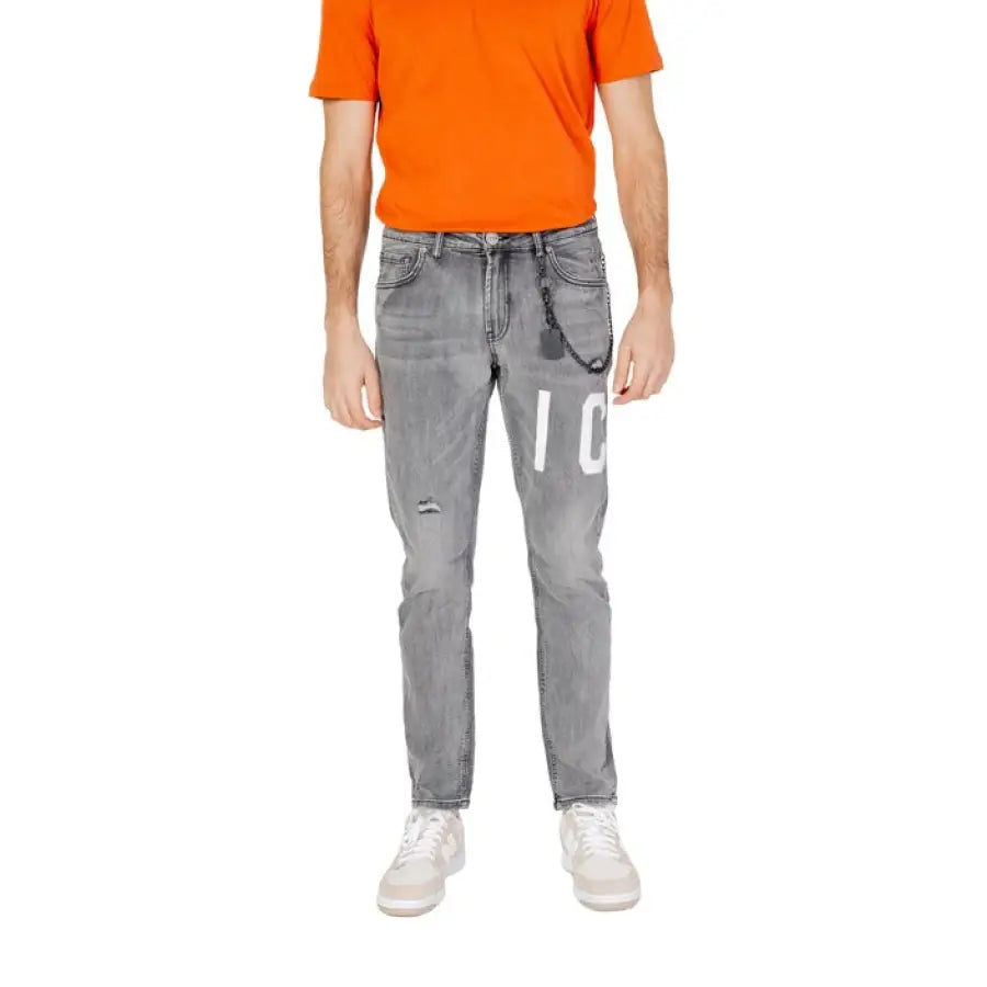 
                      
                        Man in orange shirt wearing Icon Men Jeans for urban city style
                      
                    