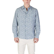 Man in patterned long-sleeved shirt and light pants wearing Replay Men’s Light Blue Floral Shirt