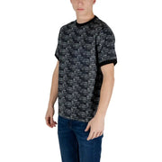Man in Ea7 Black Print Cotton T-Shirt and jeans styled effortlessly