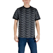 Man in patterned Ea7 Black Print Cotton T-Shirt with jeans showcasing casual style