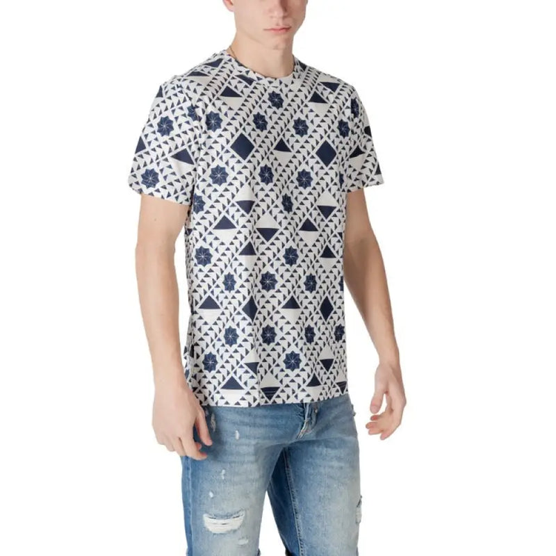 Male model wearing a white patterned short sleeve T shirt for men