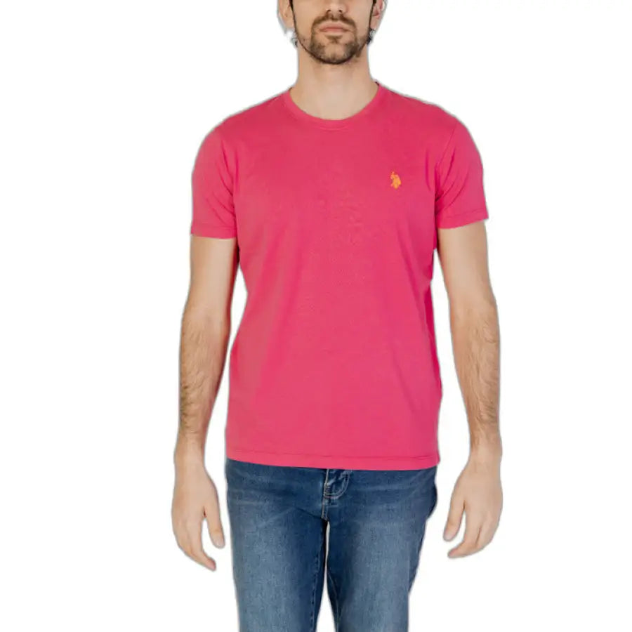Man in pink U.S. Polo Assn. men t-shirt showcasing urban style clothing