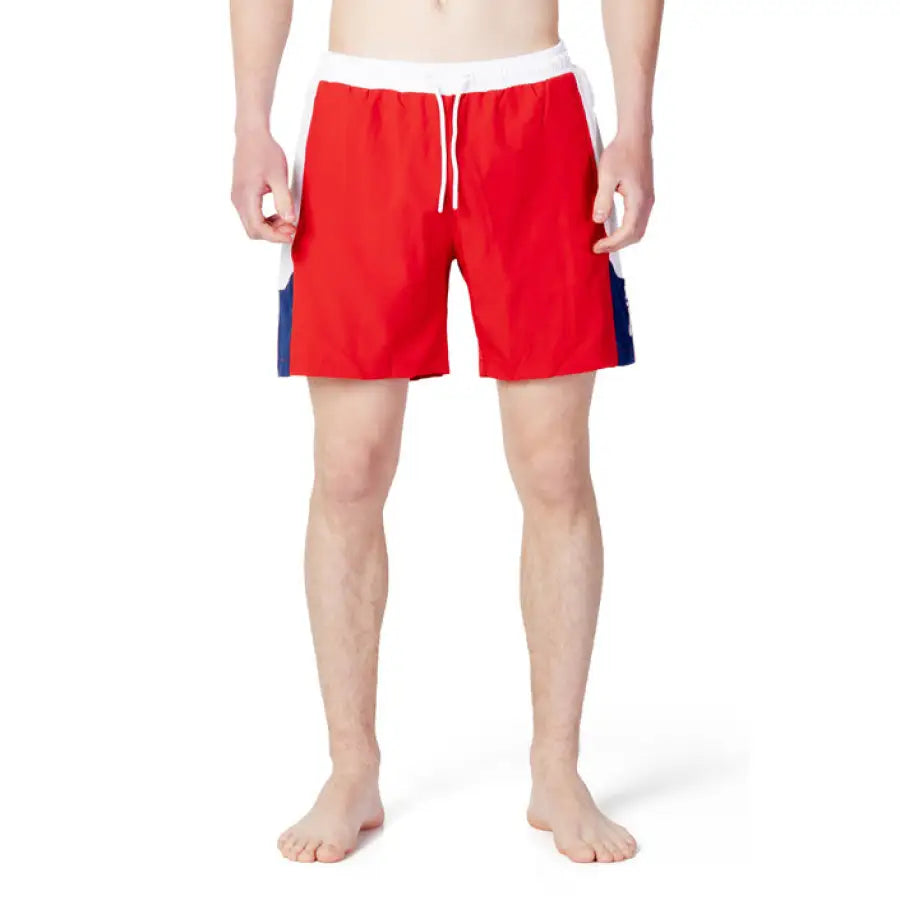 
                      
                        Fila men swimwear model in blue and red swim trunks
                      
                    
