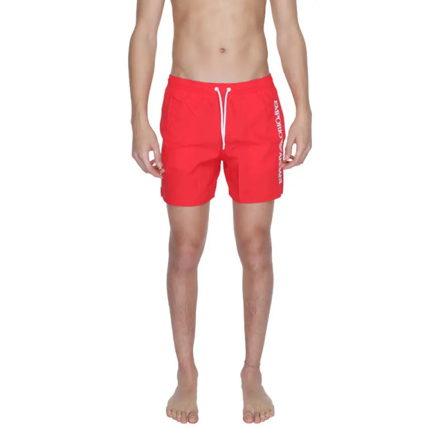 
                      
                        Man in red Emporio Armani swim trunks
                      
                    