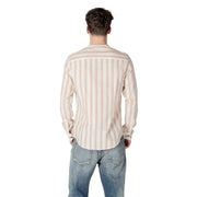 Man in a striped button shirt and jeans showcasing Gianni Lupo Men’s Beige Striped Shirt