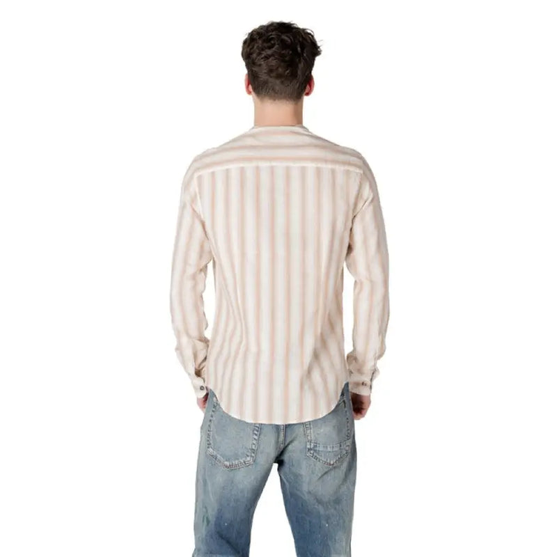 Man in a striped button shirt and jeans showcasing Gianni Lupo Men’s Beige Striped Shirt