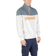 Man wearing a two-tone color blocked men’s sweatshirt and cargo pants