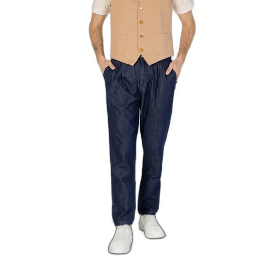 Man modeling Gianni Lupo men trousers in vest and jeans