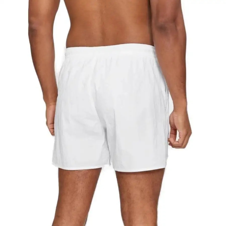 
                      
                        Man modeling white Emporio Armani underwear for men swimwear collection
                      
                    