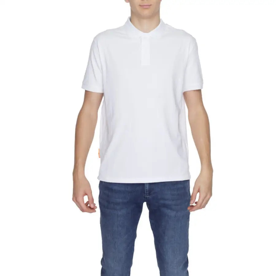 Man in white Suns Men Polo exemplifying urban city style clothing