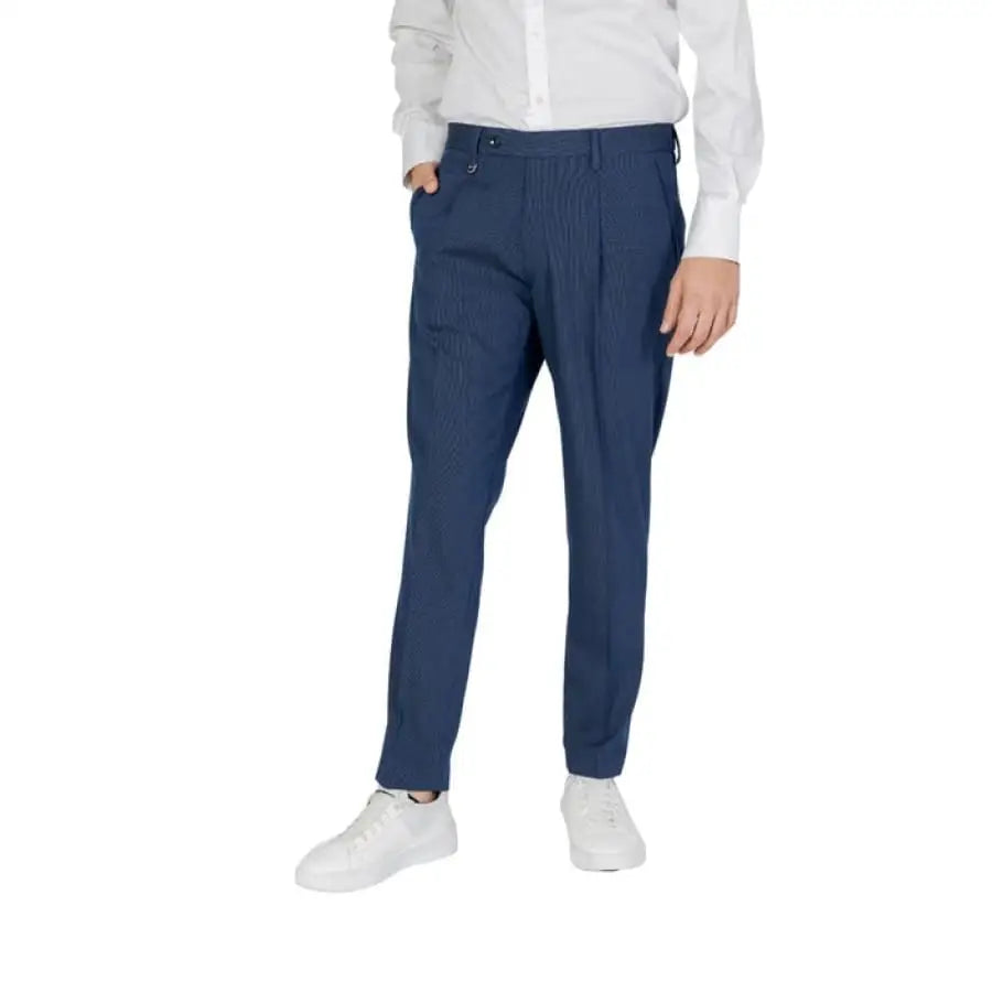 Man modeling Antony Morato Men Trousers in white shirt and blue pants