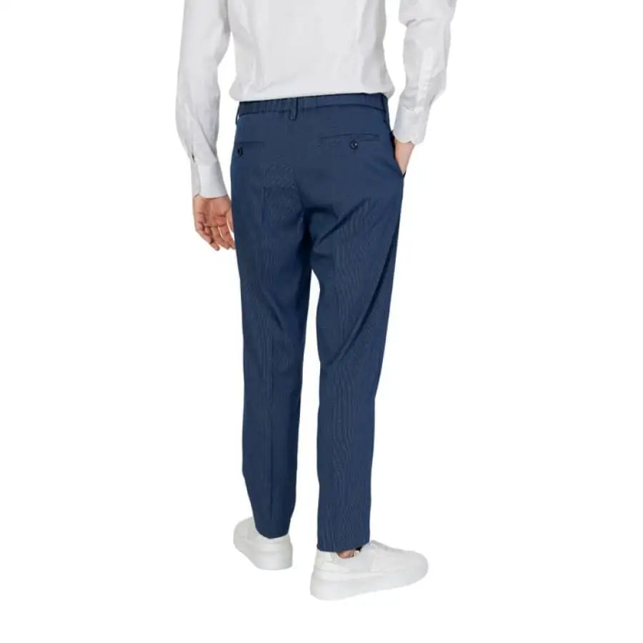 
                      
                        Man modeling Antony Morato men trousers in white shirt and blue pants.
                      
                    