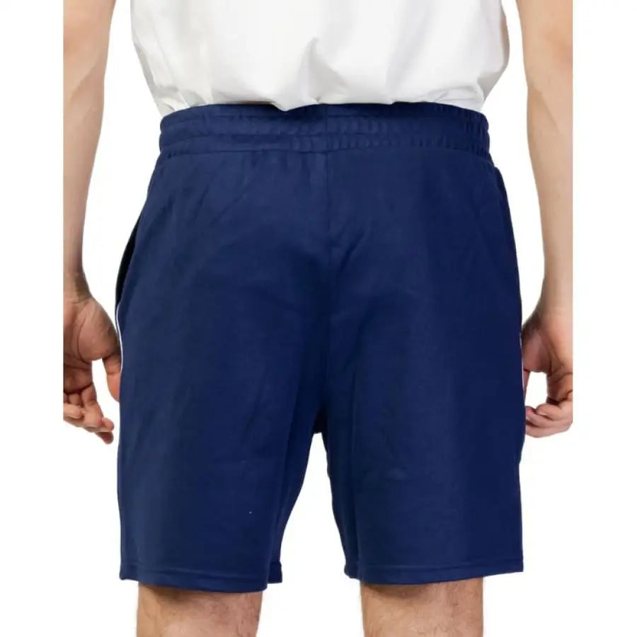 Fila Men Shorts - Man in White Shirt and Blue Fila Shorts
