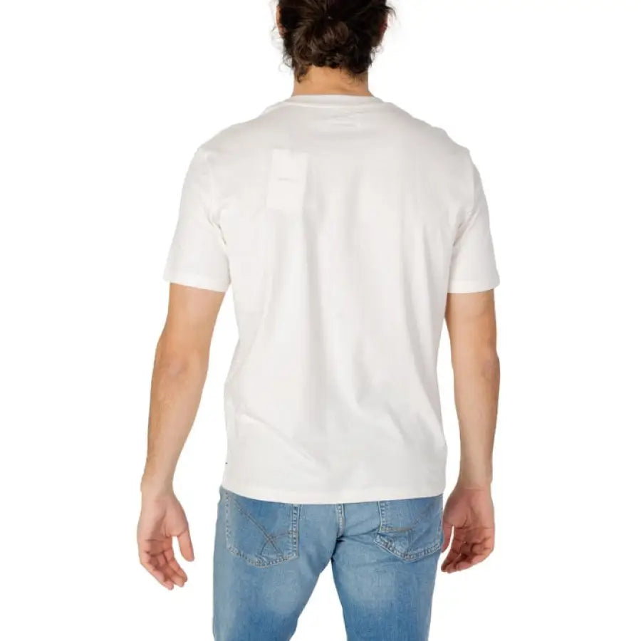 Man modeling Gas Gas Men T-Shirt in white, paired with jeans