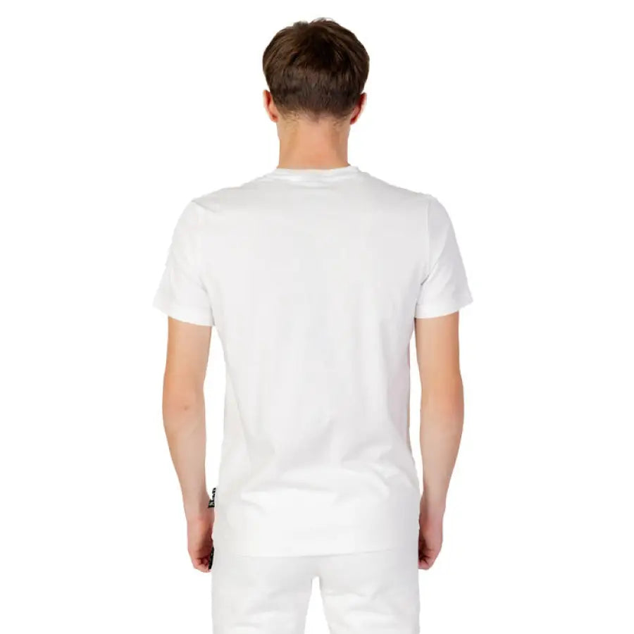 Icon Icon men wearing Icon Men T-Shirt in white, styled casually with shorts
