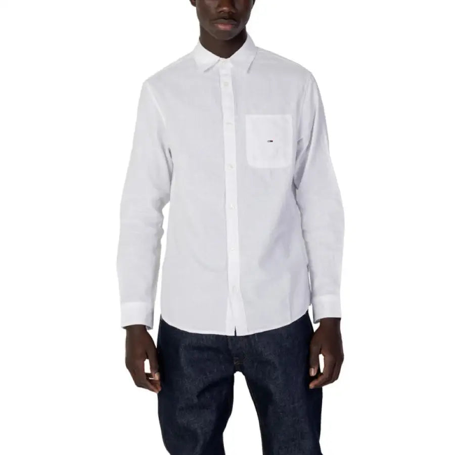 Man wearing Tommy Hilfiger jeans and white Tommy Hilfiger shirt
