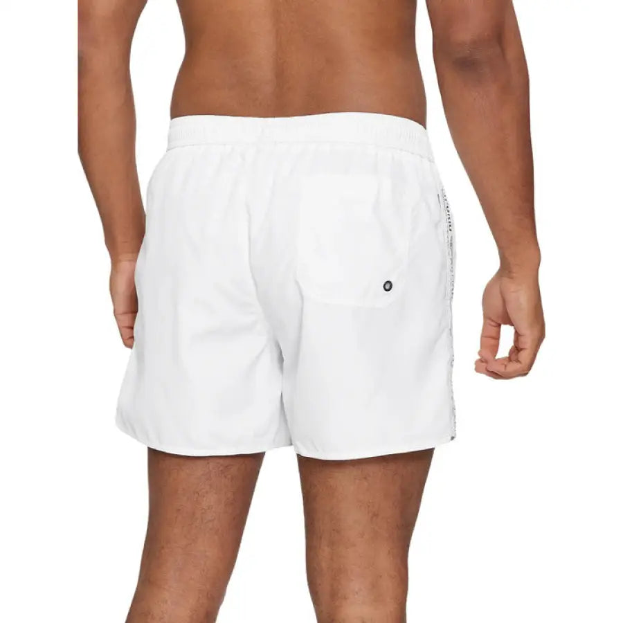 
                      
                        Emporio Armani men’s swimwear featuring man in white Armani underwear trunks
                      
                    