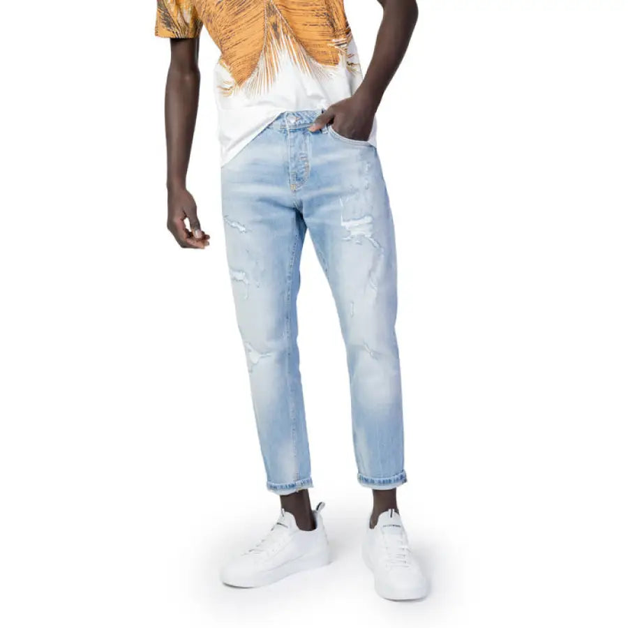 Antony Morato in white shirt and blue jeans for urban style clothing