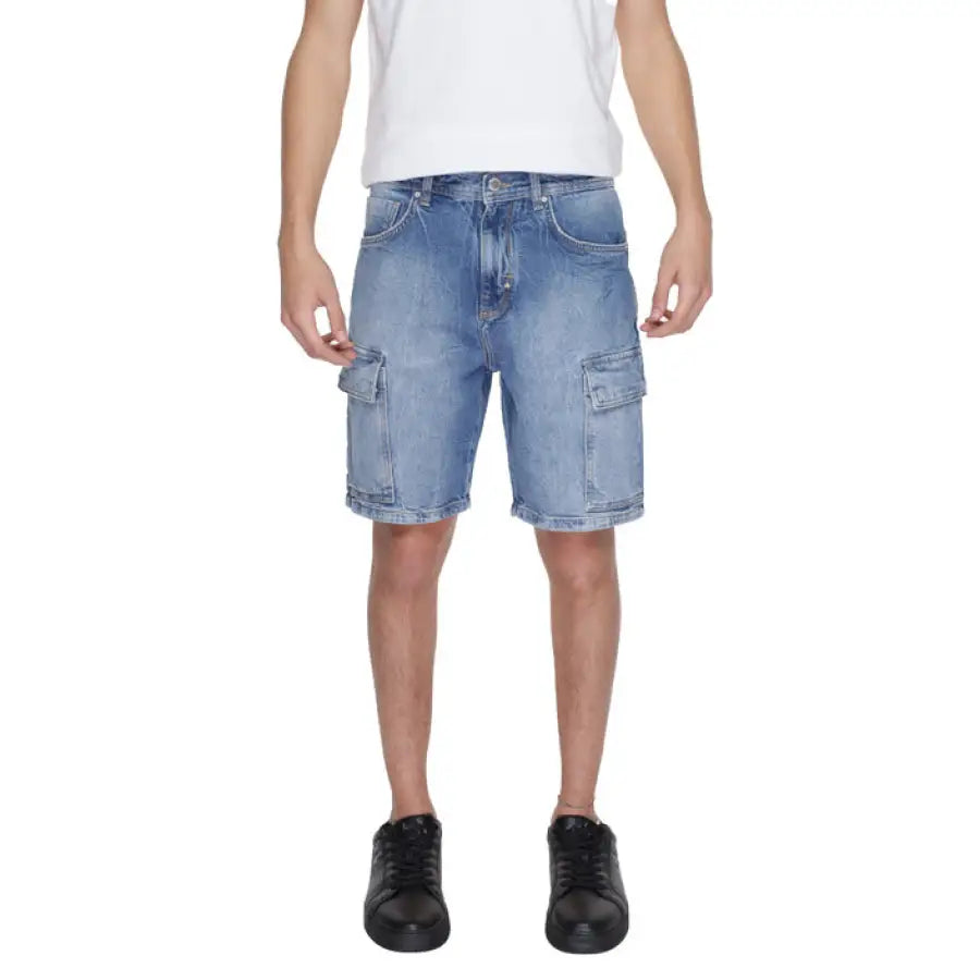 Man in Antony Morato white t-shirt and blue shorts showcasing urban style clothing