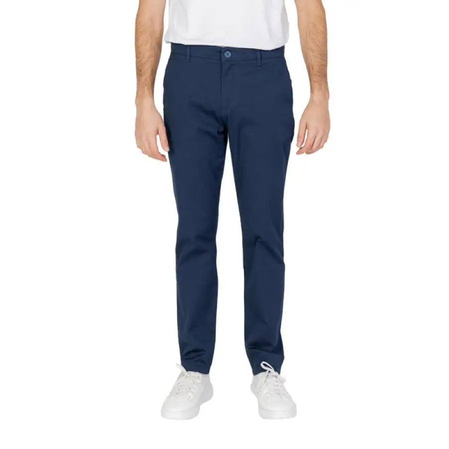 Armani Exchange - Man in white T-shirt and blue Armani Exchange Men Trousers