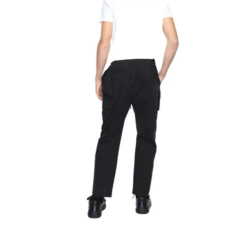 
                      
                        Gianni Lupo men trousers model in white shirt and black pants
                      
                    