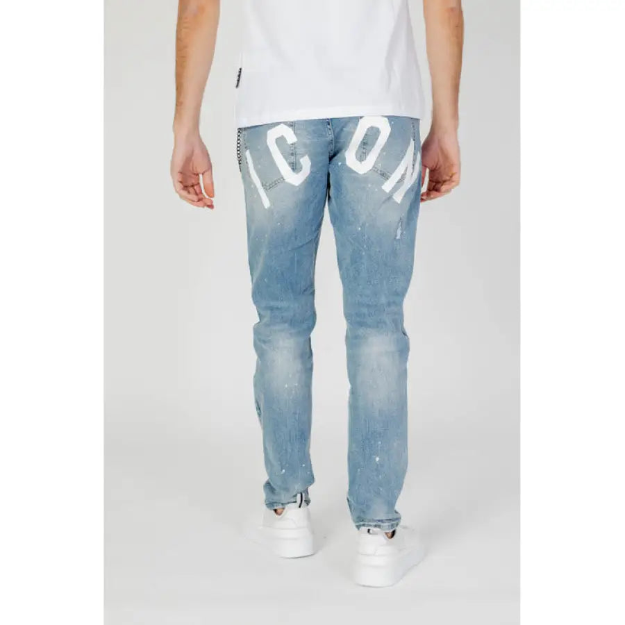 
                      
                        Man in urban style clothing, Icon Men Jeans with love design, showcasing urban city fashion
                      
                    