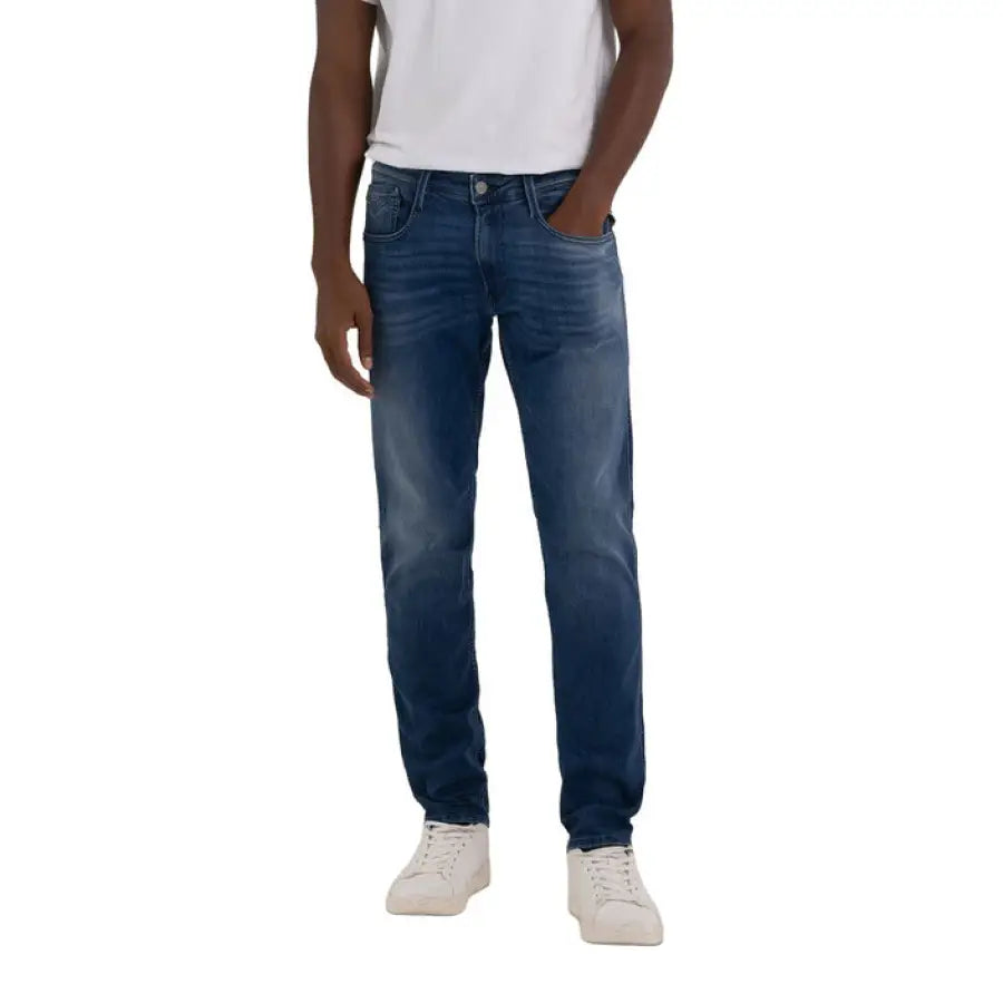 Man wearing Replay urban style clothing, jeans and white T-shirt in the city