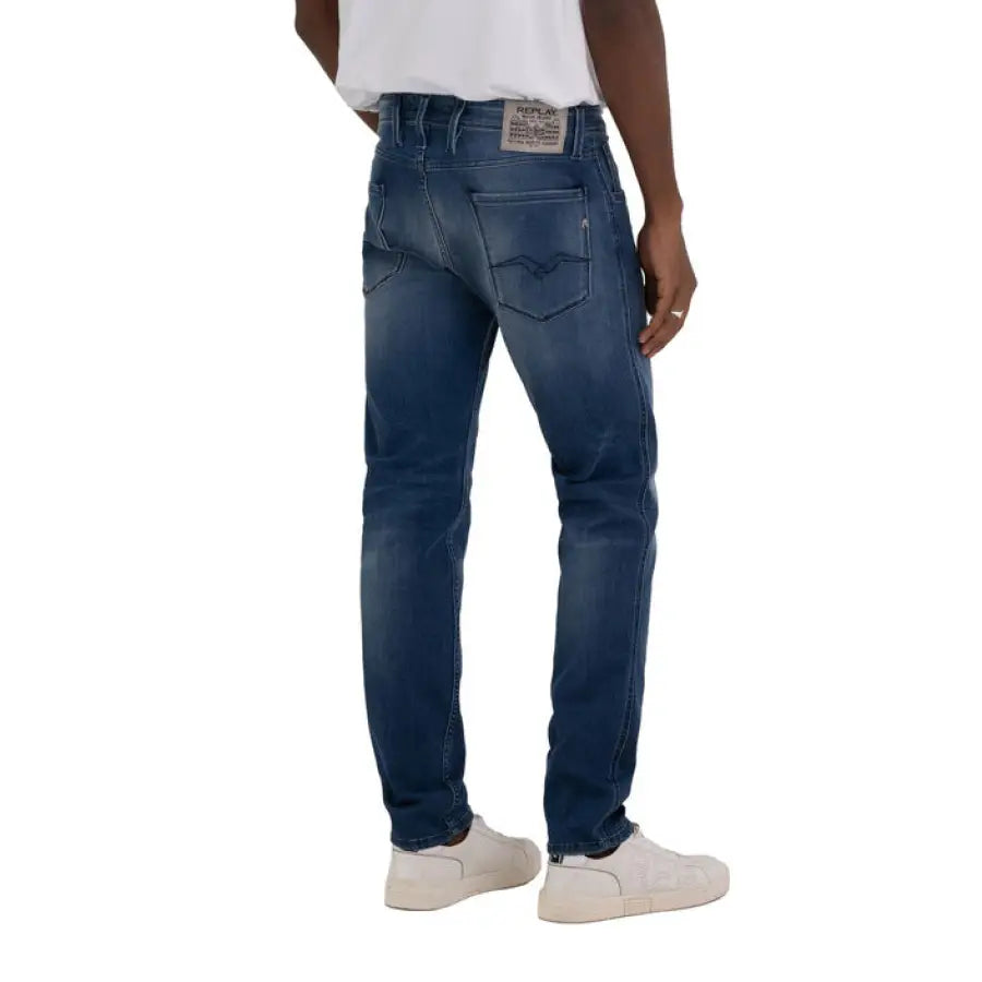 
                      
                        Man in white t-shirt and Replay Men Jeans showcasing urban city style fashion
                      
                    