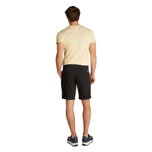 Man wearing yellow T-shirt and black chino shorts for Men’s Yellow T-Shirt and Black Chino Shorts product