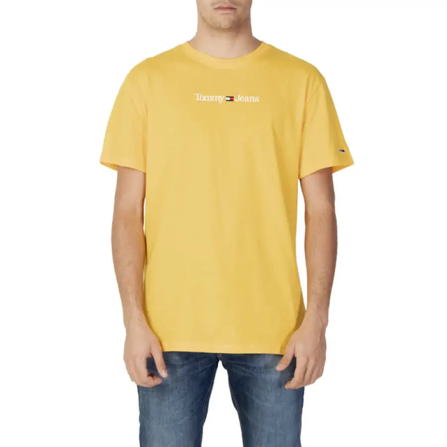 Man in Tommy Hilfiger Jeans yellow Champion t-shirt