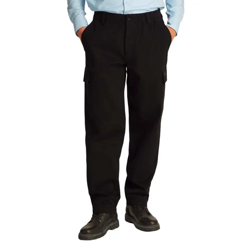 Men’s black cargo pants by Calvin Klein featuring side pockets and button closure for casual wear