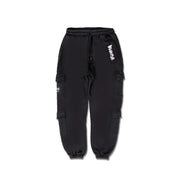 Men’s black cotton cargo pants with laces and multiple pockets featuring white graffiti-style lettering on the thigh