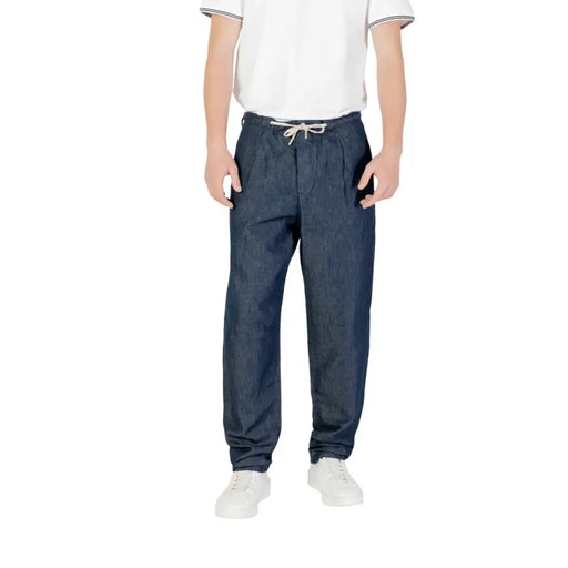 Men’s dark blue denim drawstring pants with a relaxed fit and white drawstring waistband for casual wear