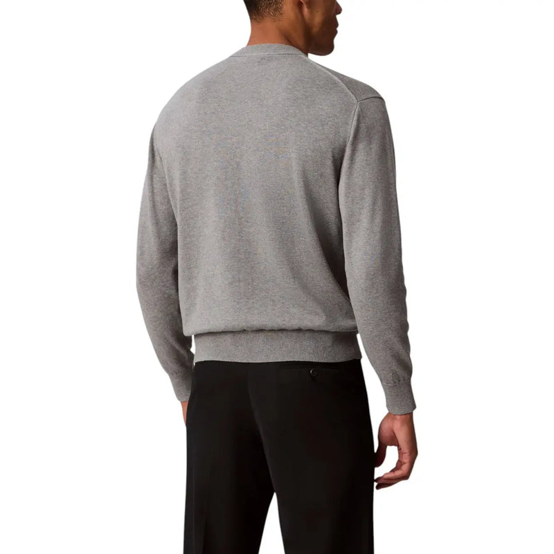 Mens gray long sleeved sweater made of heather gray knit fabric with ribbed cuffs and hem for casual wear