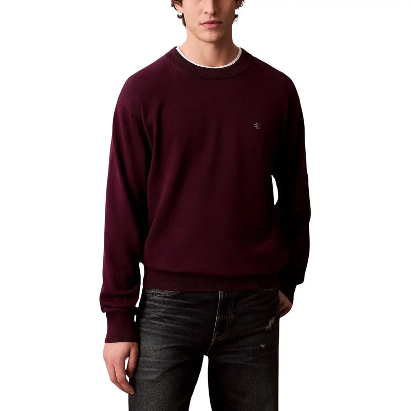 Mens gray long sleeved sweater in maroon crewneck design with white ribbed collar and subtle chest embroidery