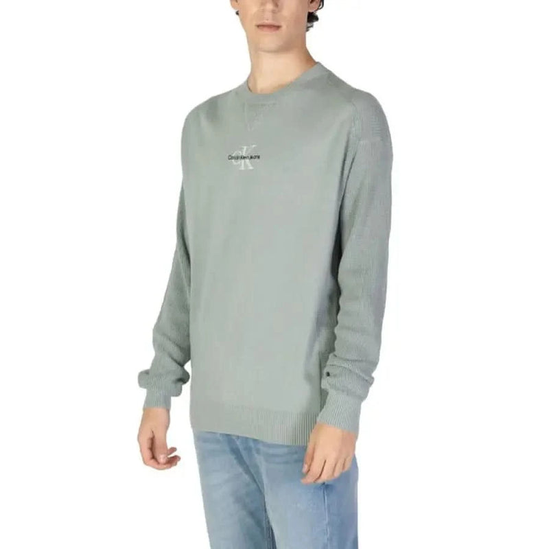 Mint green Calvin Klein Jeans crewneck sweatshirt featuring minimal branding for men