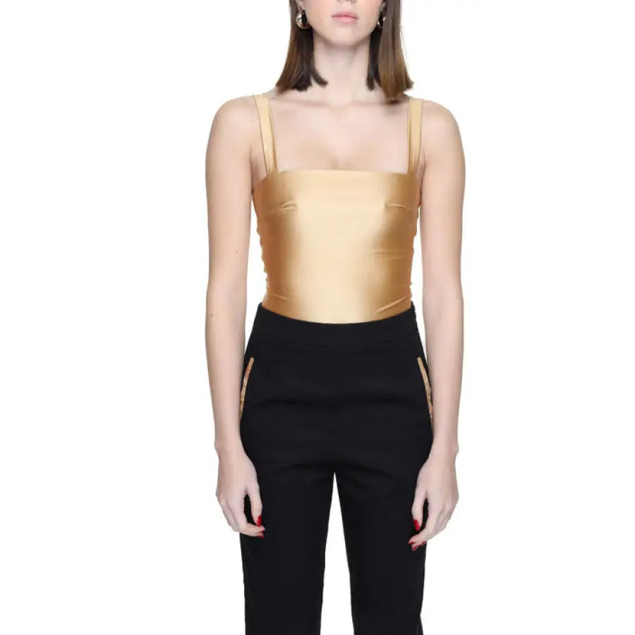 Model in urban style clothing with gold top and black pants for Silence Women Underwear