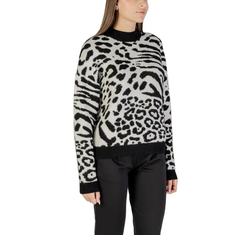 Women’s white leopard print crew-neck knit sweater with black cuffs and hem by Morgan De Toi