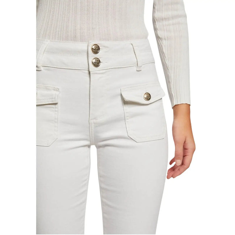 White high-waisted Morgan de toi jeans with gold-toned buttons paired with a ribbed knit top for spring summer