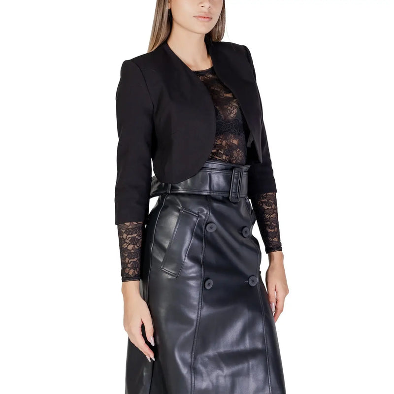 Morgan De Toi women’s black cardigan with 3/4 sleeves featuring lace detailing paired with a black faux leather skirt