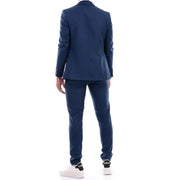 Men’s navy blue slim-fit suit with two-button blazer and white sneakers for spring summer fashion