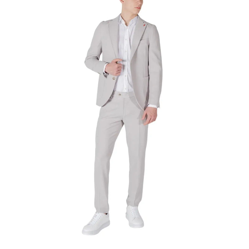 Mulish men grey slim fit suit in polyester viscose blend worn over white dress shirt with white sneakers