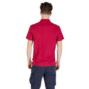 Red polo shirt with short sleeves and navy cargo pants.