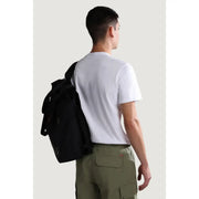 Black backpack with subtle logo patch on lower side shown from the back for napapijri men t shirt product