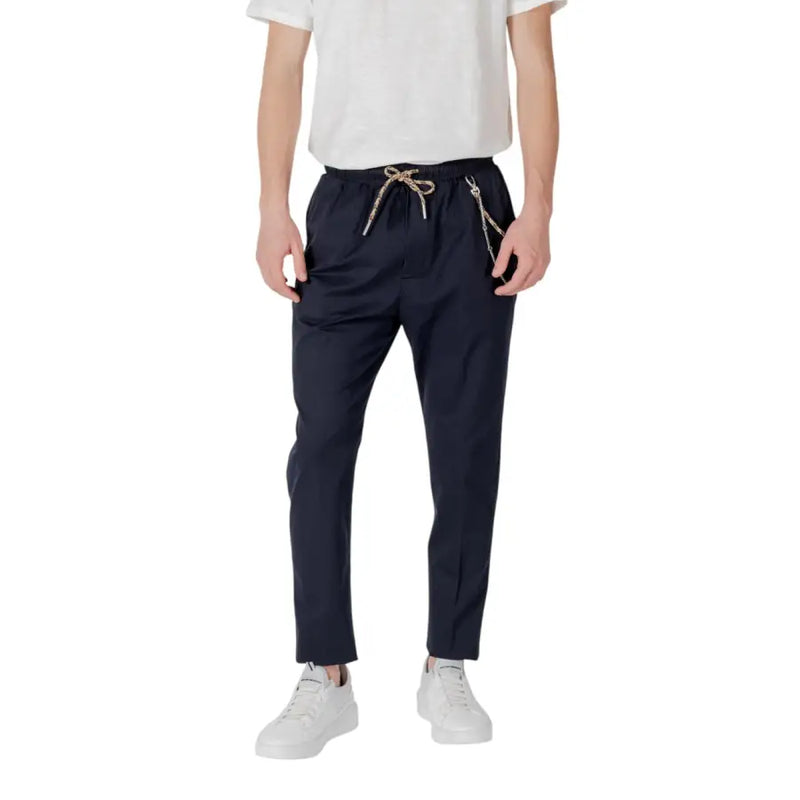 Dark navy chino trousers with a drawstring waist and metallic chain detailing on side pockets