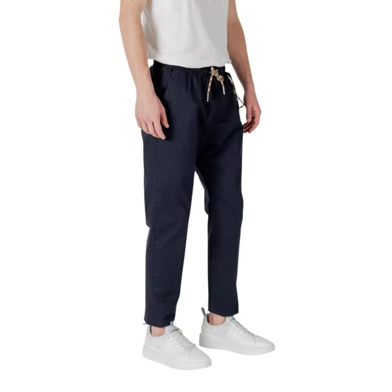 Navy blue drawstring trousers with subtle patterned cord and tapered legs, ideal for casual and smart wear