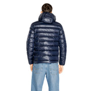 Navy blue quilted puffer jacket with hood designed for warmth and comfort in cold weather conditions