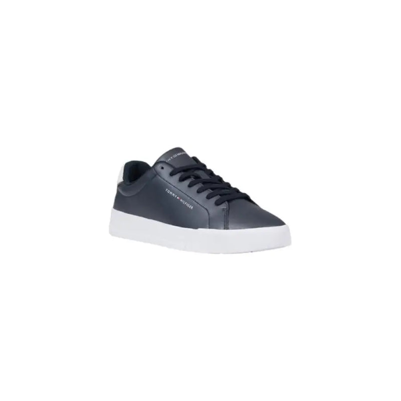 Navy blue leather sneaker with white sole displayed in Tommy Hilfiger product image