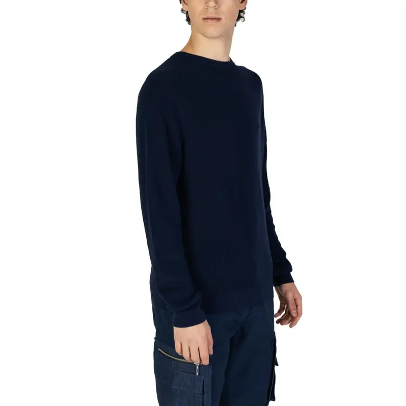 Navy blue ribbed knit long-sleeved sweater with zippered pocket designed for casual and comfortable wear