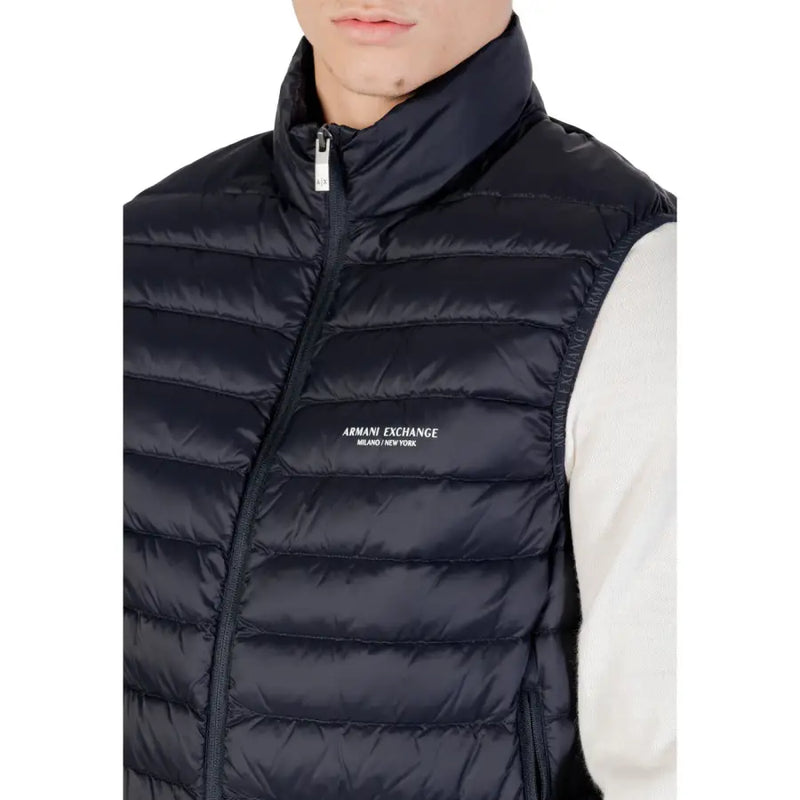 Black quilted puffer vest with high collar front zipper and armani exchange logo embroidered on chest in navy blue product listing